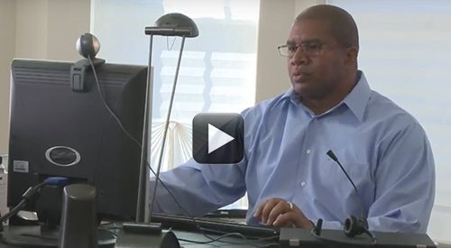 Veteran Derek Smith using his computer.