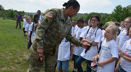 MD. Adjutant General Singhon talking to children during Military Experience Day.