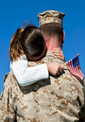 serviceman holding daughter
