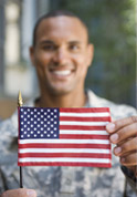 soldier holding American flag