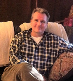 photo of Dan Martin sitting in chair, smiling